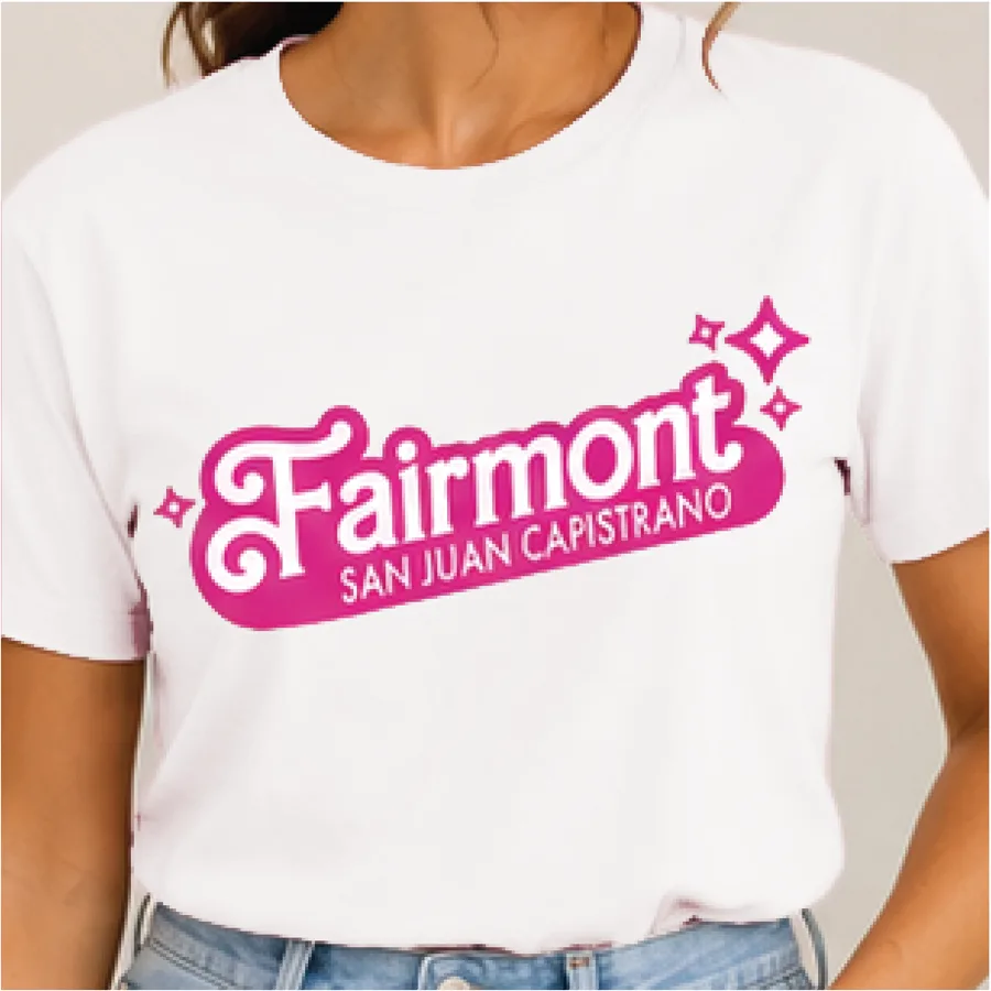 White t-shirt with the Fairmont San Juan Capistrano logo in orchid pink